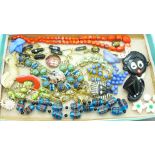 A collection of costume jewellery including brooches and necklaces including glass cane beads