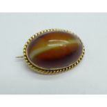 A yellow metal, 'cat's eye' brooch, 4g, 15mm x 20mm, (tests as 9ct gold)