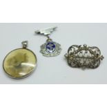 A silver and enamel Naval drop brooch, a white metal set paste brooch, c.1900, and an Edward VII