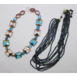 A copper and blue stone necklace and a Czechoslovakian bead necklace