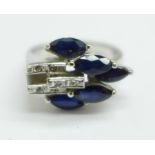 An 18ct white gold, sapphire and diamond Art Deco style ring, faint 18k mark, 5.8g, N