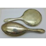 A silver backed mirror and brush