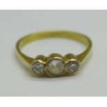 An 18ct gold and three stone diamond ring, 3g, S