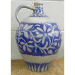 A stoneware ewer with blue glaze, 41.5cm