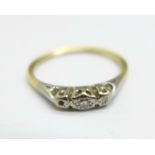 A yellow and white metal set ring, lacking one small diamond, shank worn, 1.6g, N