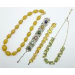 A citrine set bracelet, a Celtic bracelet, a paste set necklace and a Bakelite necklace