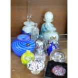 A collection of glass scent bottles, paperweights, etc.