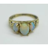 A 9ct gold, three stone opal ring, a/f, small chip on centre stone, one other stone reset, 2.1g, N