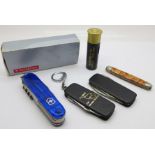 A Victorinox multi-tool pocket knife, with box and four others