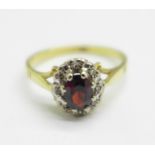 An 18ct gold, garnet and diamond cluster ring, 3.4g, O