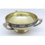 A white metal Arts and Crafts three handled bowl/dish decorated with eight small circular enamel