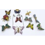 A collection of butterfly and bug brooches