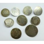 Nine continental silver coins made into buttons