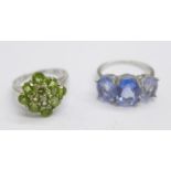 A silver and blue stone ring and a silver and peridot ring