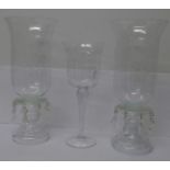 Two glass candle holders and an etched glass