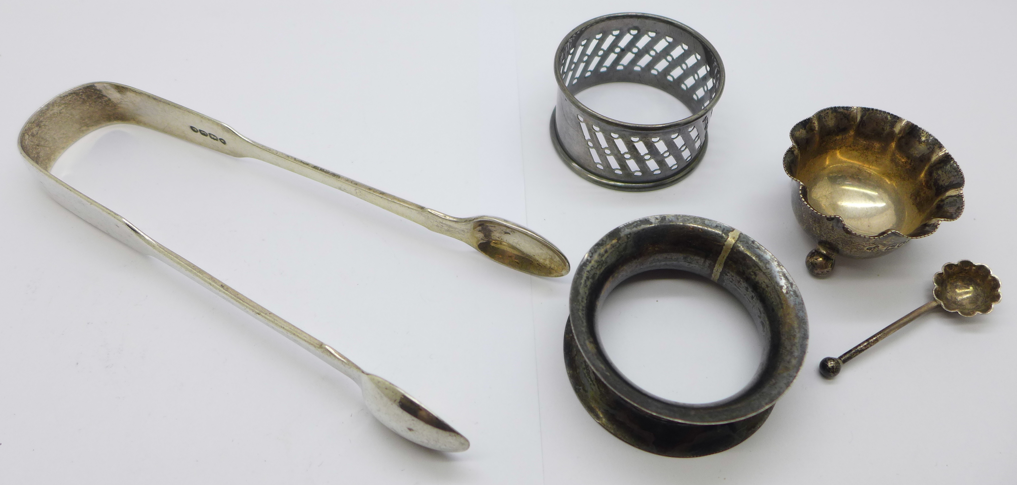 Silver;-sugar bows, two napkin rings and a salt with spoon, 93g