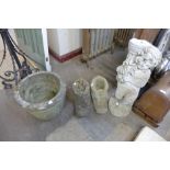 A pair of concrete boot shaped planters, another planter and a cherub water feature, a/f