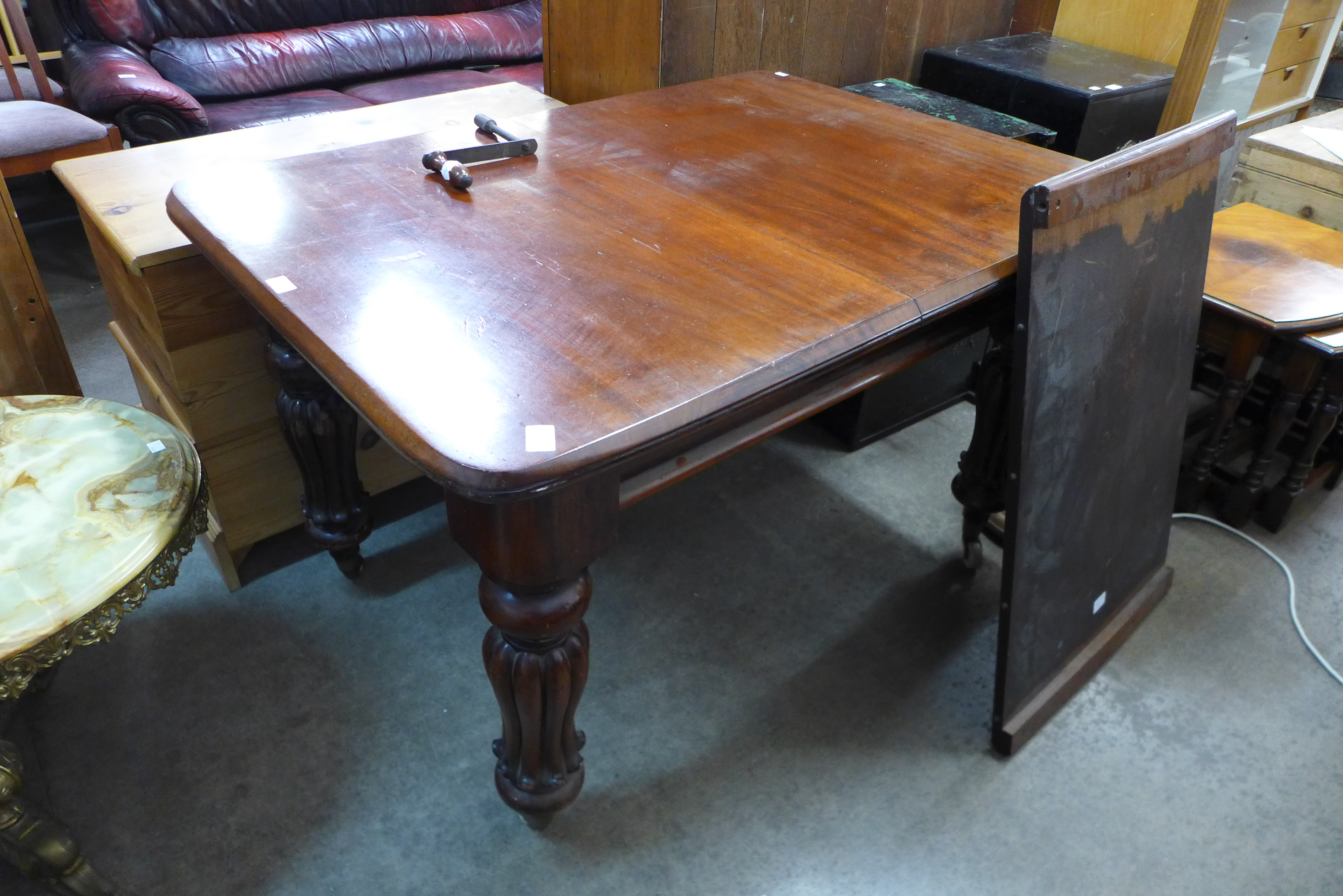 A small Victorian mahogany extending dining table