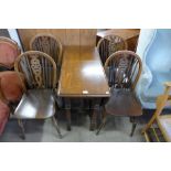 An oak gateleg table and four wheelback chairs