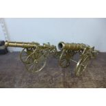 A pair of brass model cannons