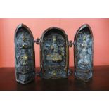 An oriental bronze triptych