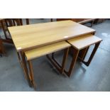 A teak drop-leaf nest of tables