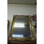 A gilt framed mirror