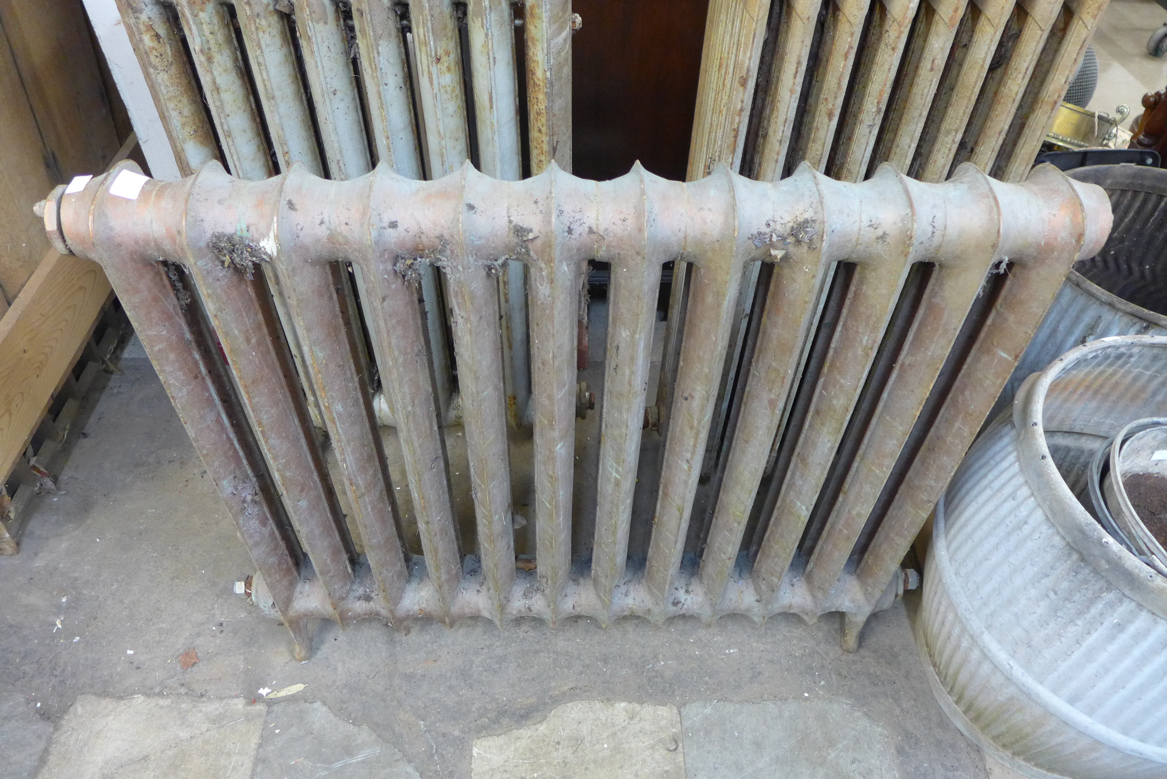 Three Victorian cast iron radiators