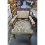 A Victorian carved walnut and upholstered armchair