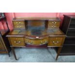 An Edward VII mahogany bow front lady's writing desk