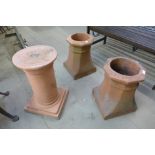 Three terracotta chimney pots
