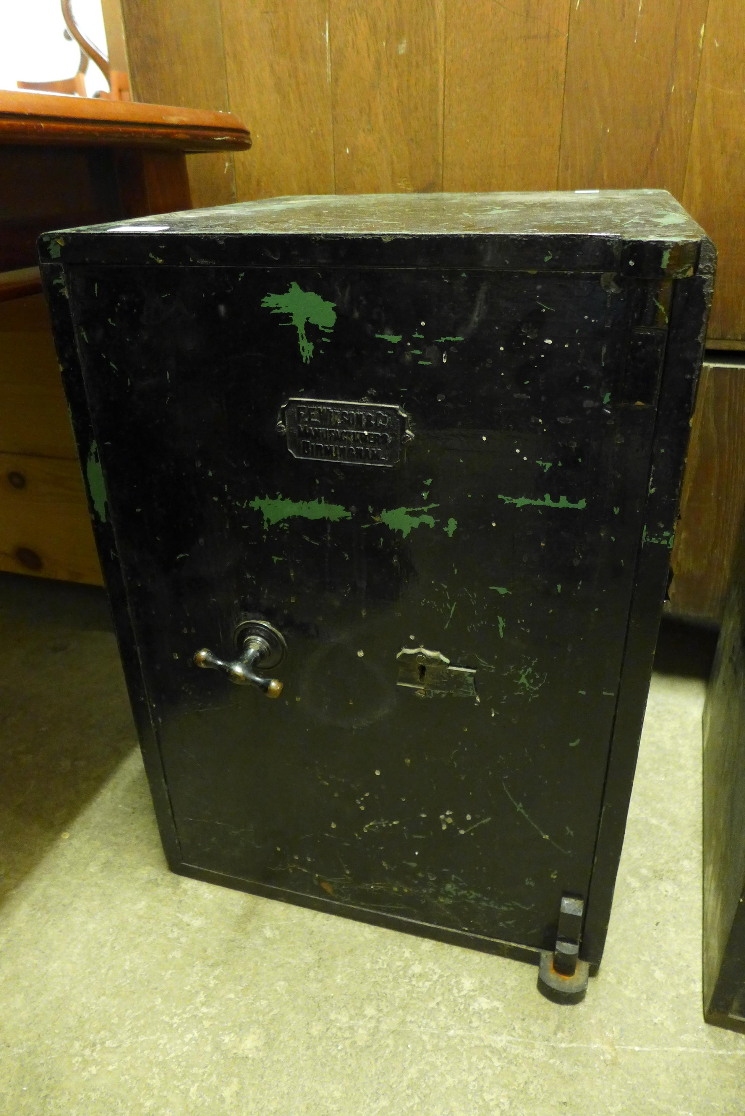 A F.E. Wilson cat iron safe - with key