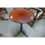 A George III mahogany circular tilt-top tripod table, 69cms h x 39cms d