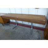 A teak and chrome four drawer console table