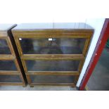 A Globe Wernicke oak three tier sectional stacking bookcase