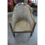 A George IV rosewood bergere library armchair
