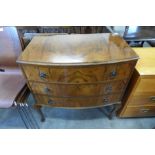 A walnut bow front chest of drawers