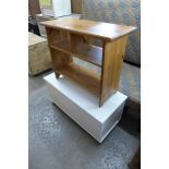 A teak whatnot, a small pine bookcase and a blanket box