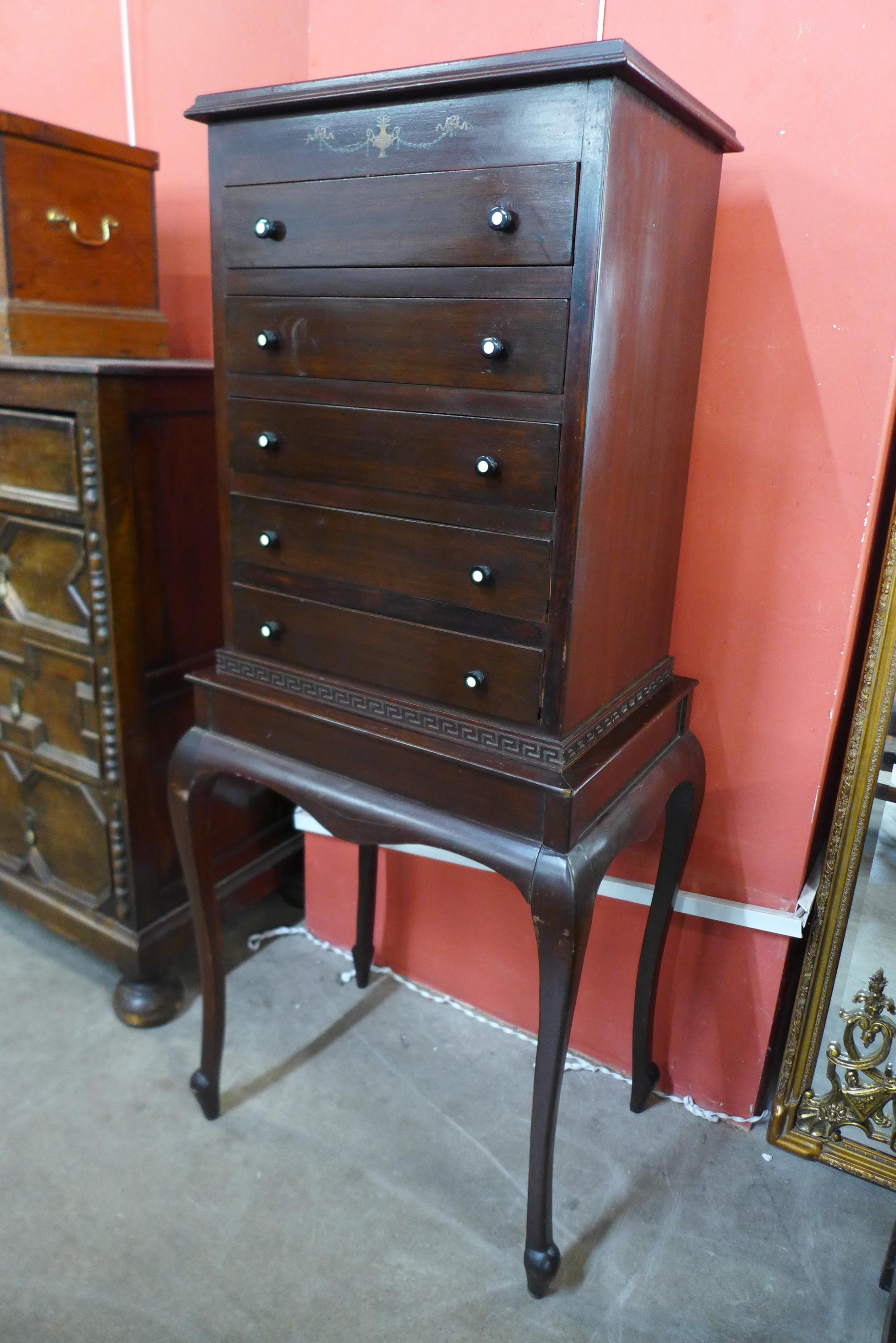 An Edward VII Neo-Classical style mahogany music cabinet