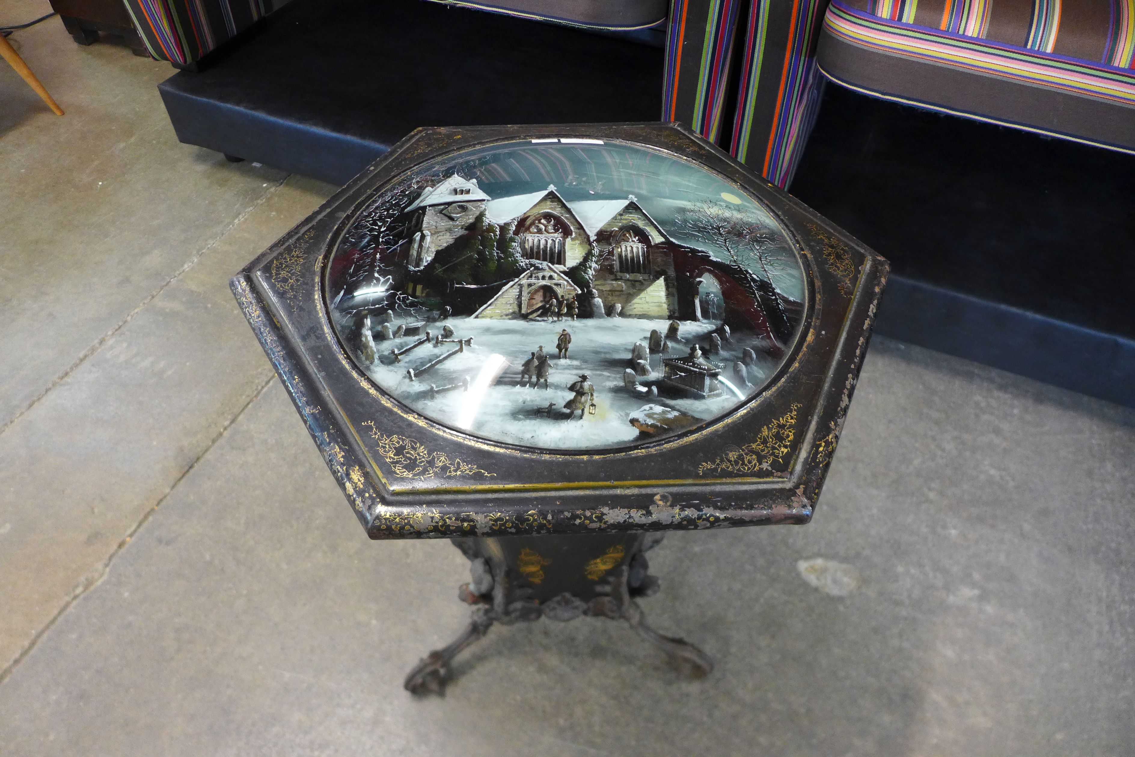 A Victorian Toleware octagonal trumpet shaped coal box, the top hand painted with church winter