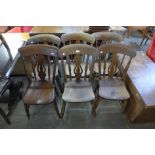 A set of six Victorian elm and beech kitchen chairs