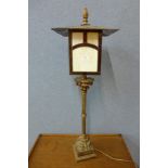 A gilt metal lantern style table lamp