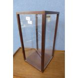 A small beech and perspex display cabinet