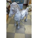 A child's tin plate rocking horse