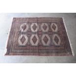 An eastern terracotta ground rug, 174 x 126cms