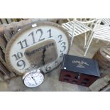 Two contemporary wall clocks and a wine rack