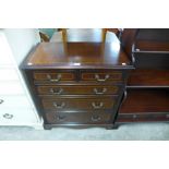 An inlaid mahogany chest of drawers