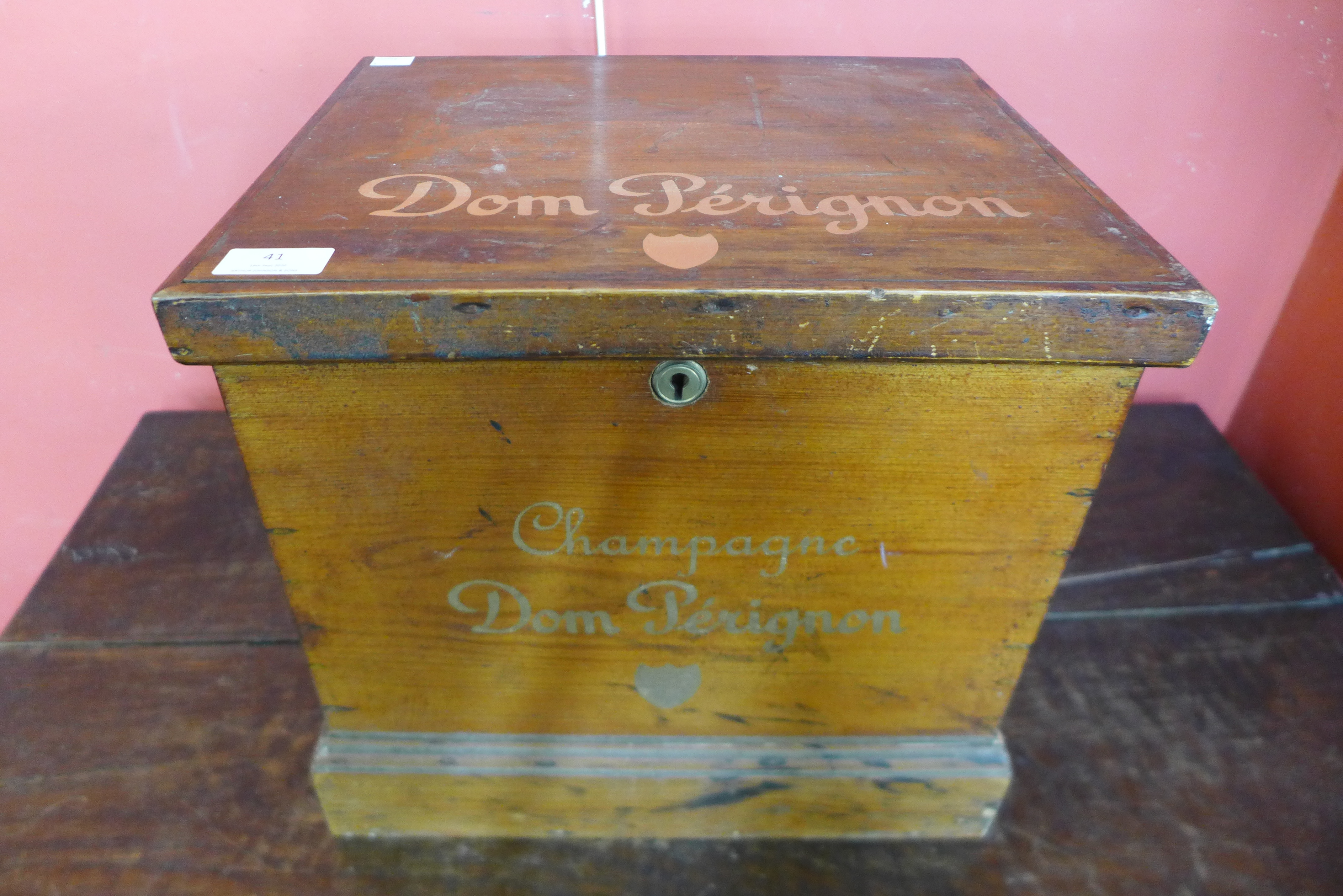 A pine box, bearing Dom Perignon Champagne inscription