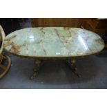 A gilt metal and onyx coffee table