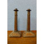 A pair of 19th Century continental leather and brass studded candlesticks